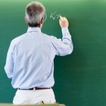 551824-teacher-at-blackboard